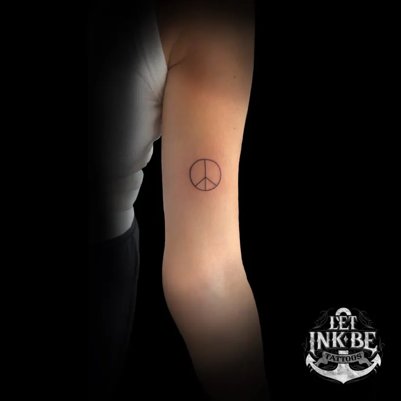 fine line tattoo peace sign